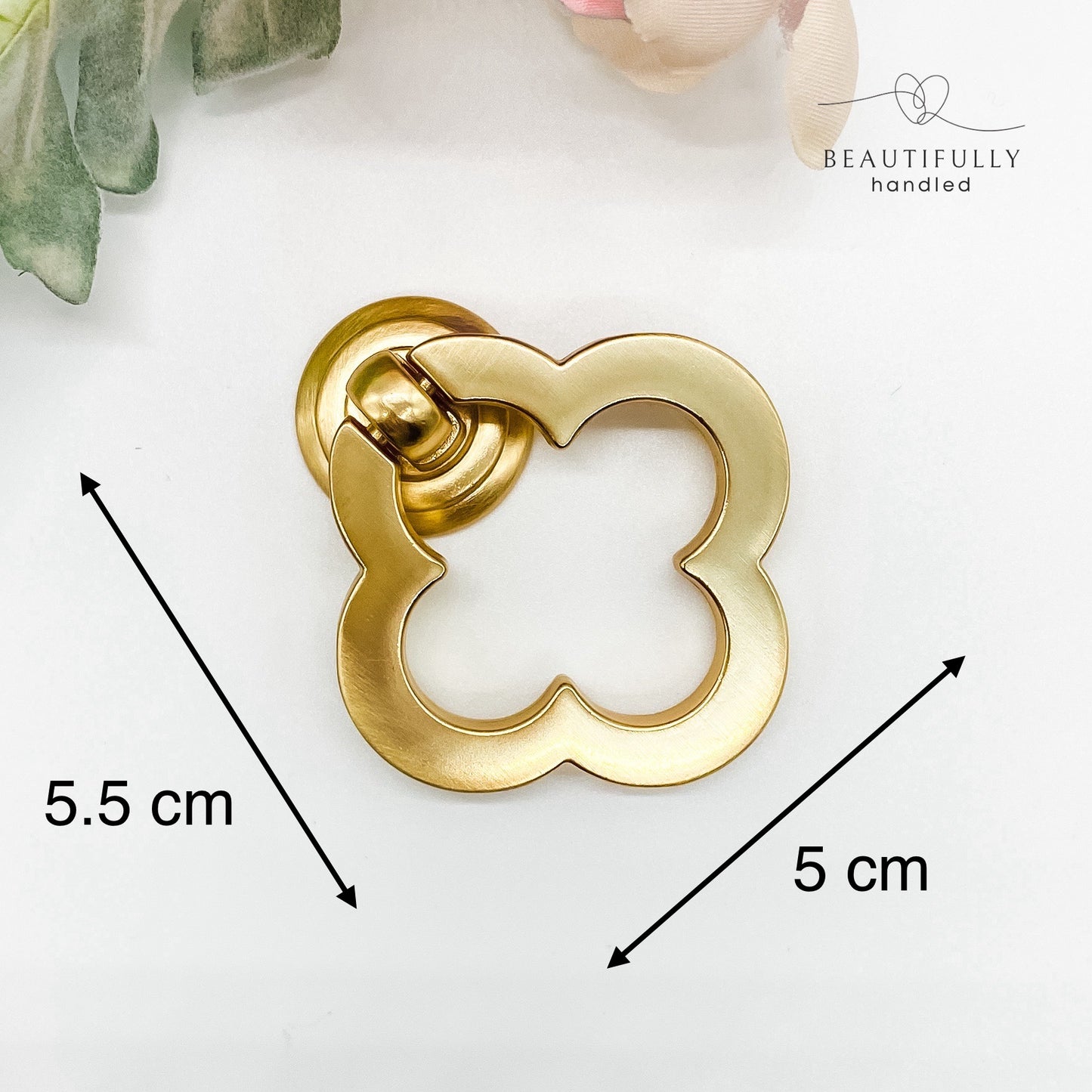 Brushed gold flower shaped clover leaf drawer handle on white background with dimensions