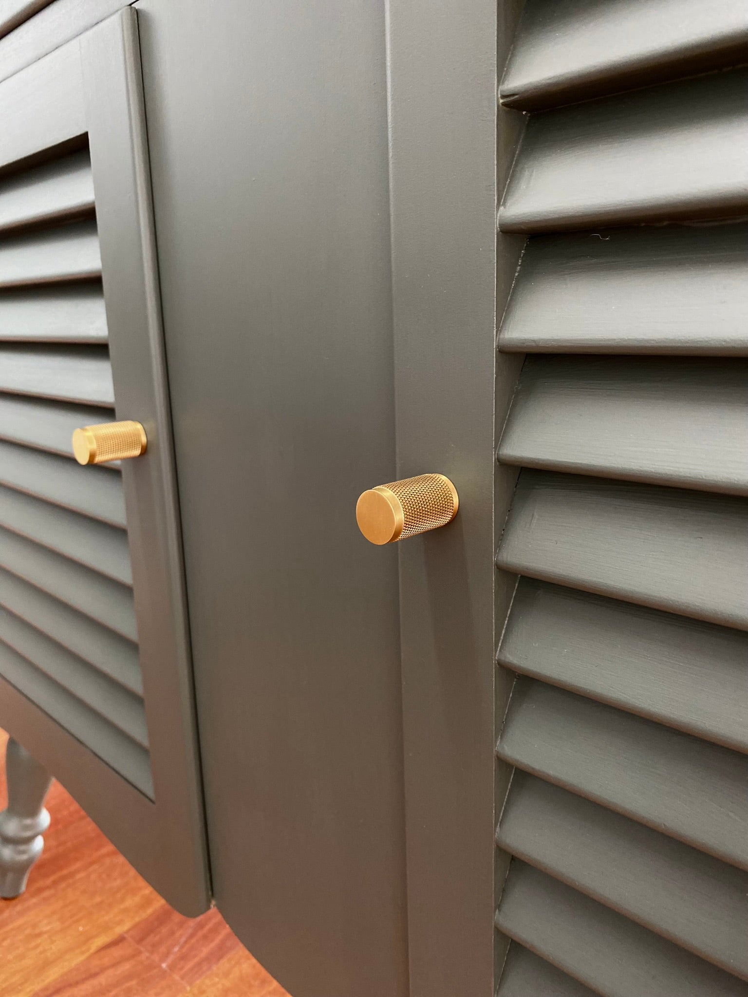 charcoal painted buffet with walnut stained top and solid brass knurled drawer knob