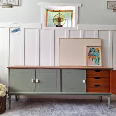 marble drawer knob on sage green sideboard in vintage living room on rug