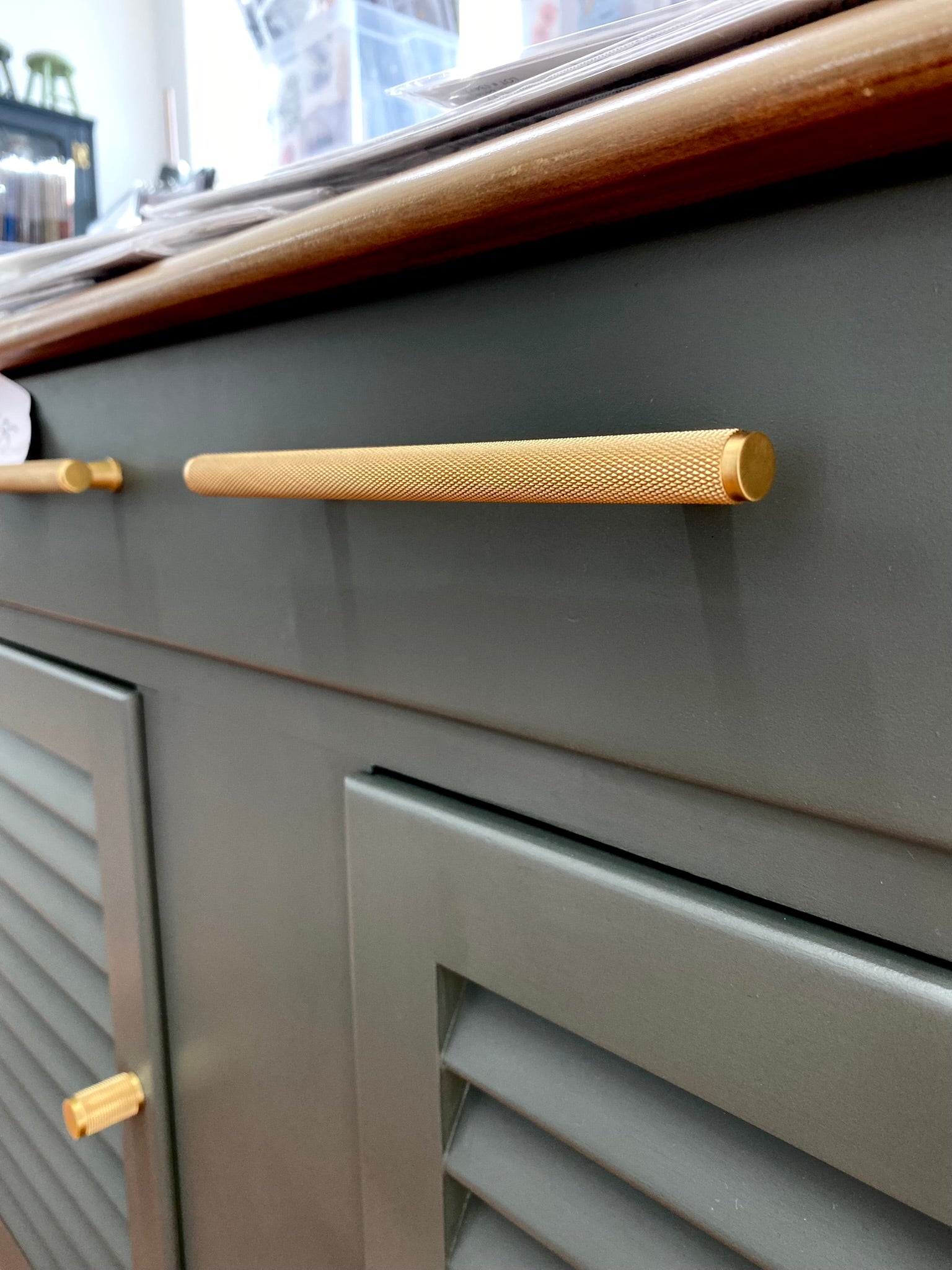 charcoal painted buffet with walnut stained top and solid brass knurled drawer handle