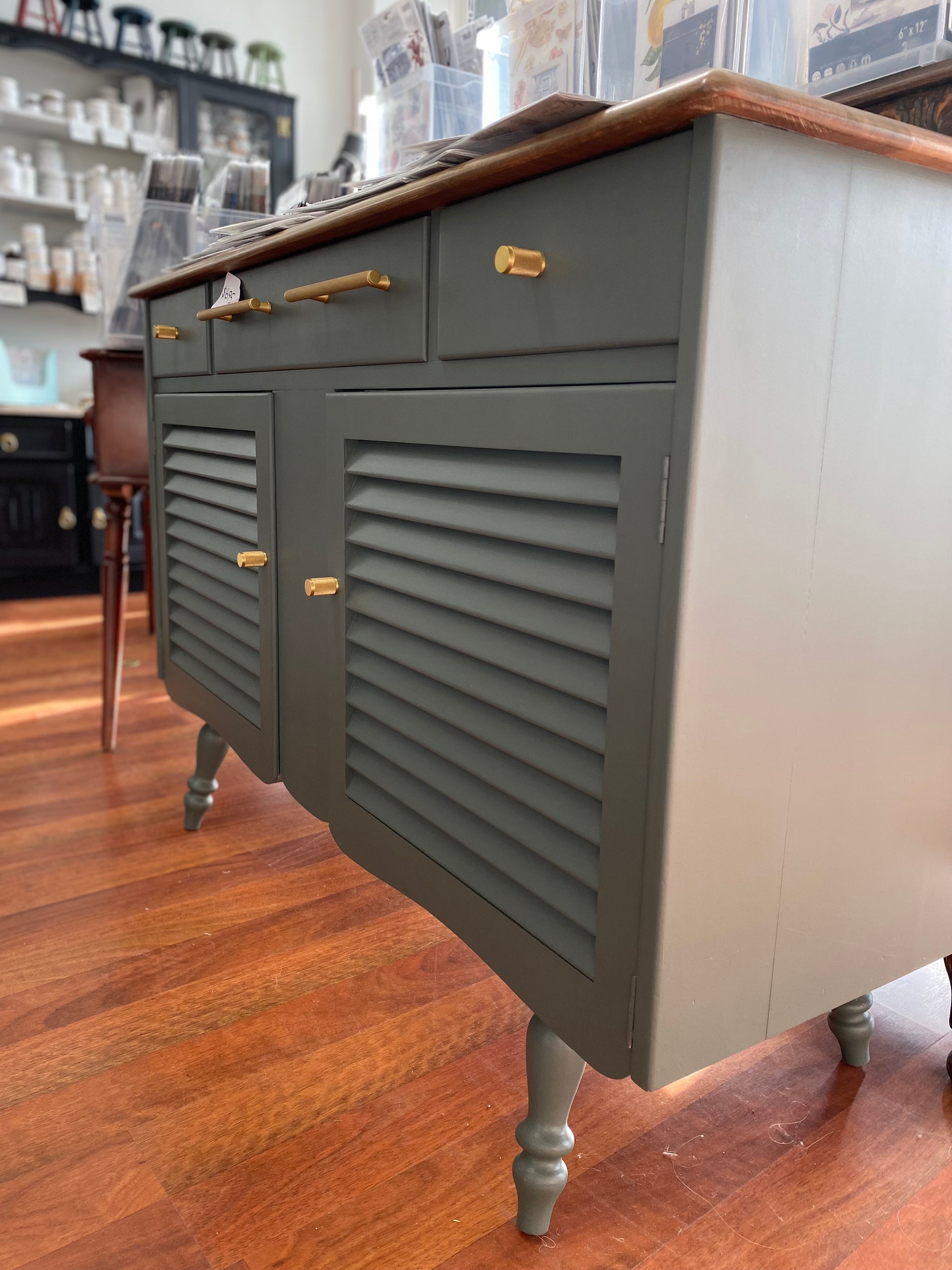 mid century buffet painted in charcoal with solid brass handles and knobs