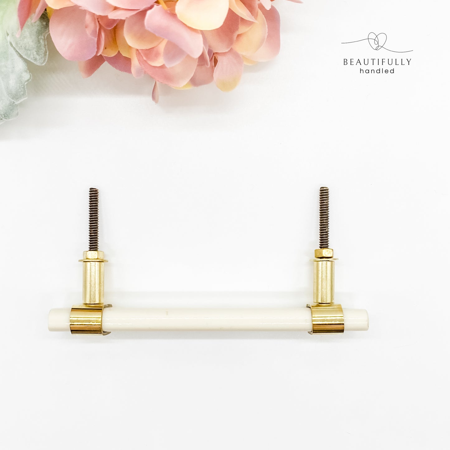 White resin and brass handle