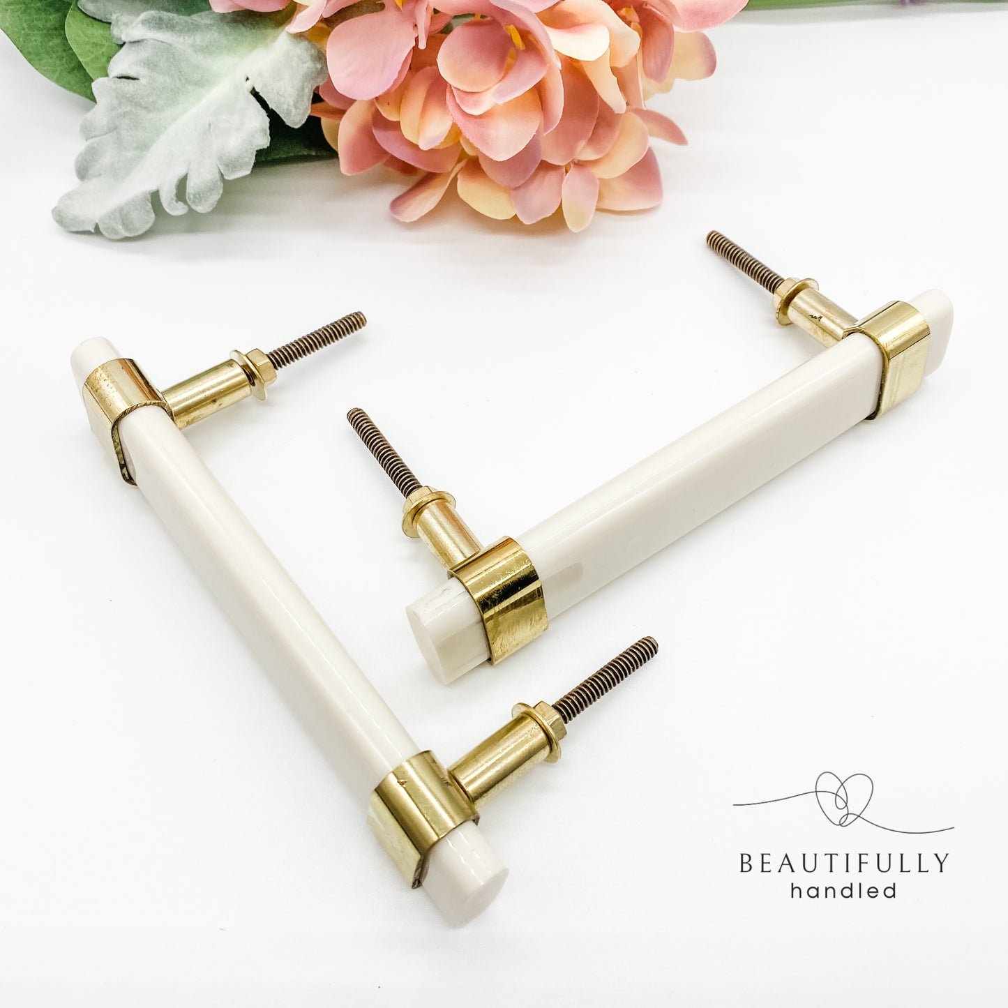 White resin and brass handle