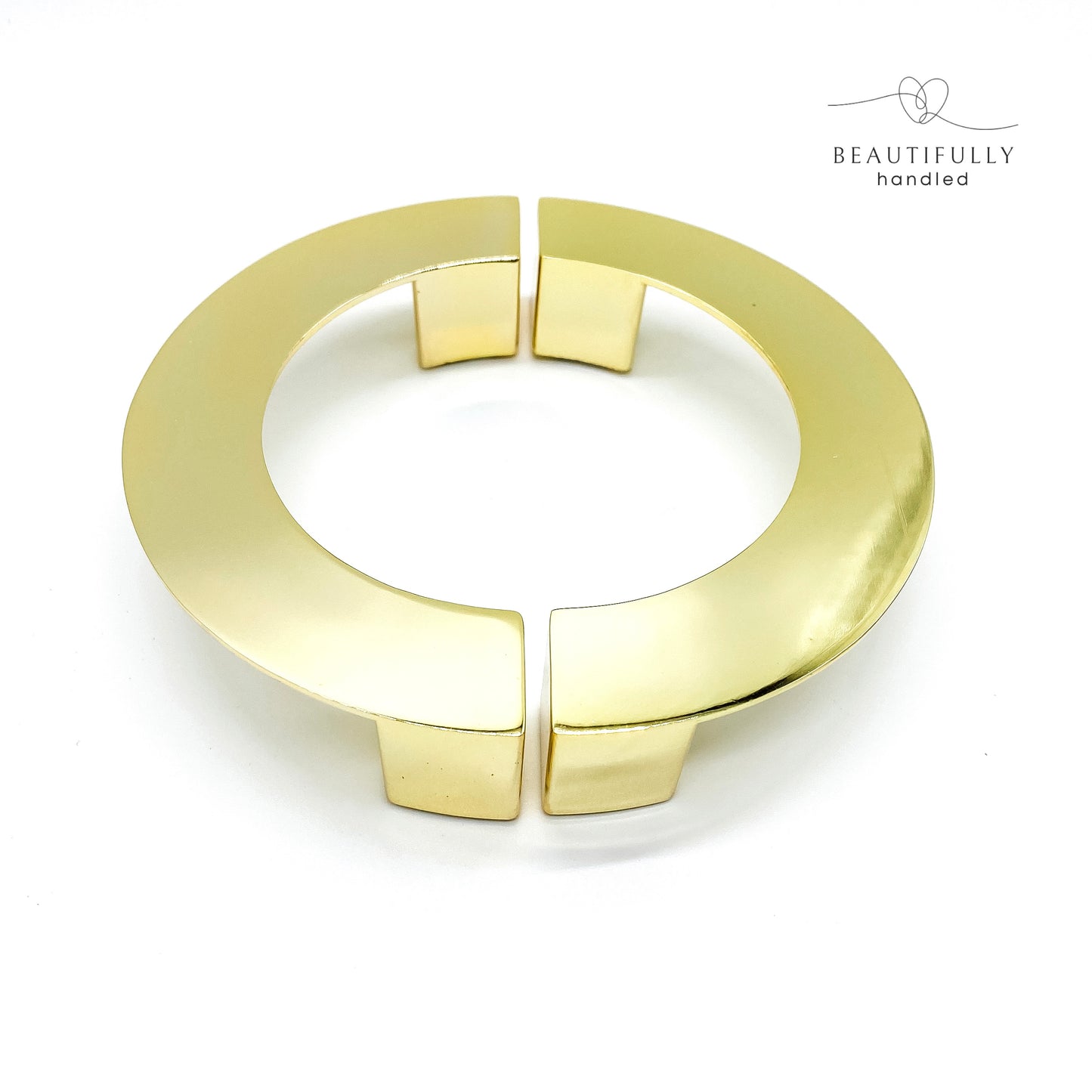 Gold C-shaped half-moon handle