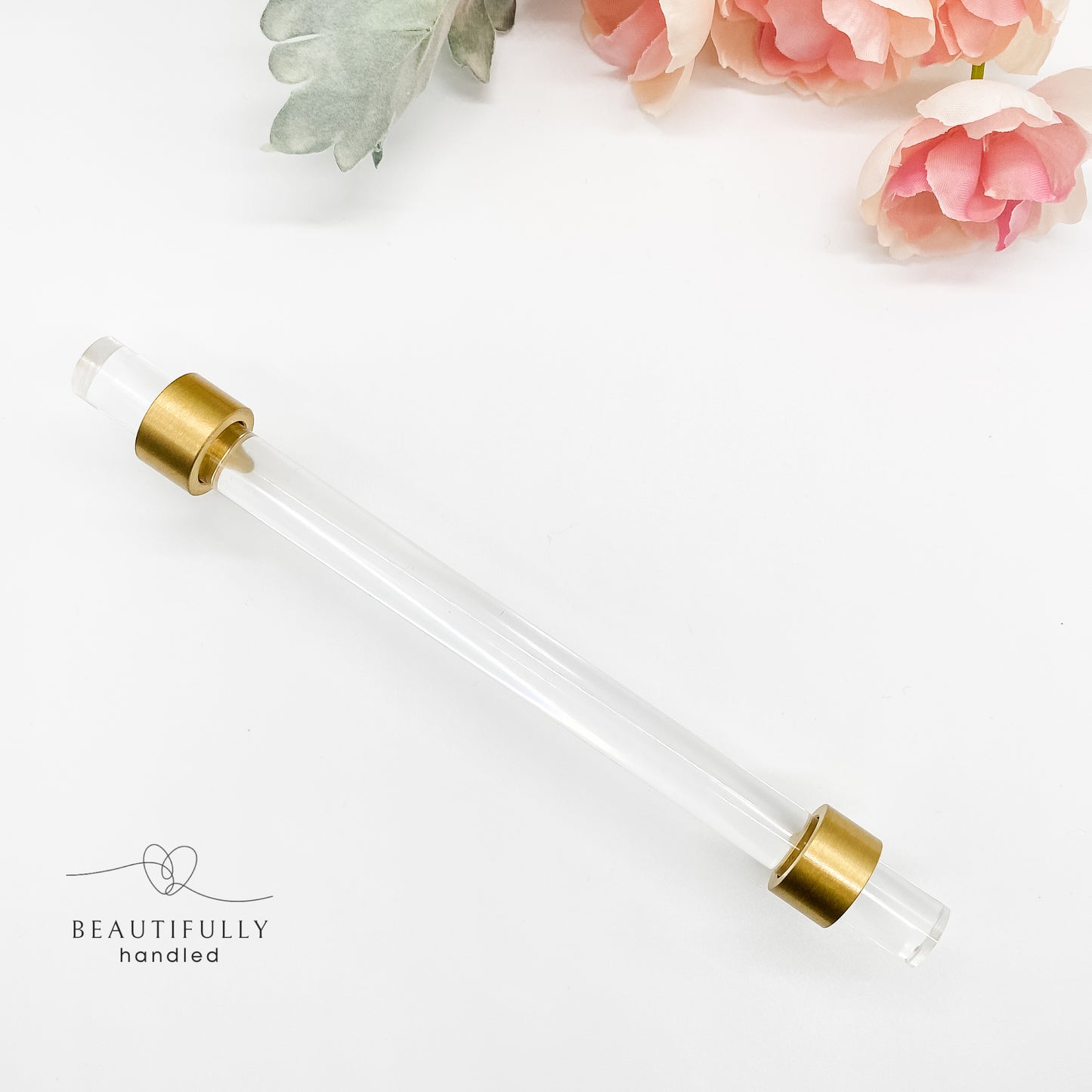 drawer handle 128mm clear acrylic and brass on white background