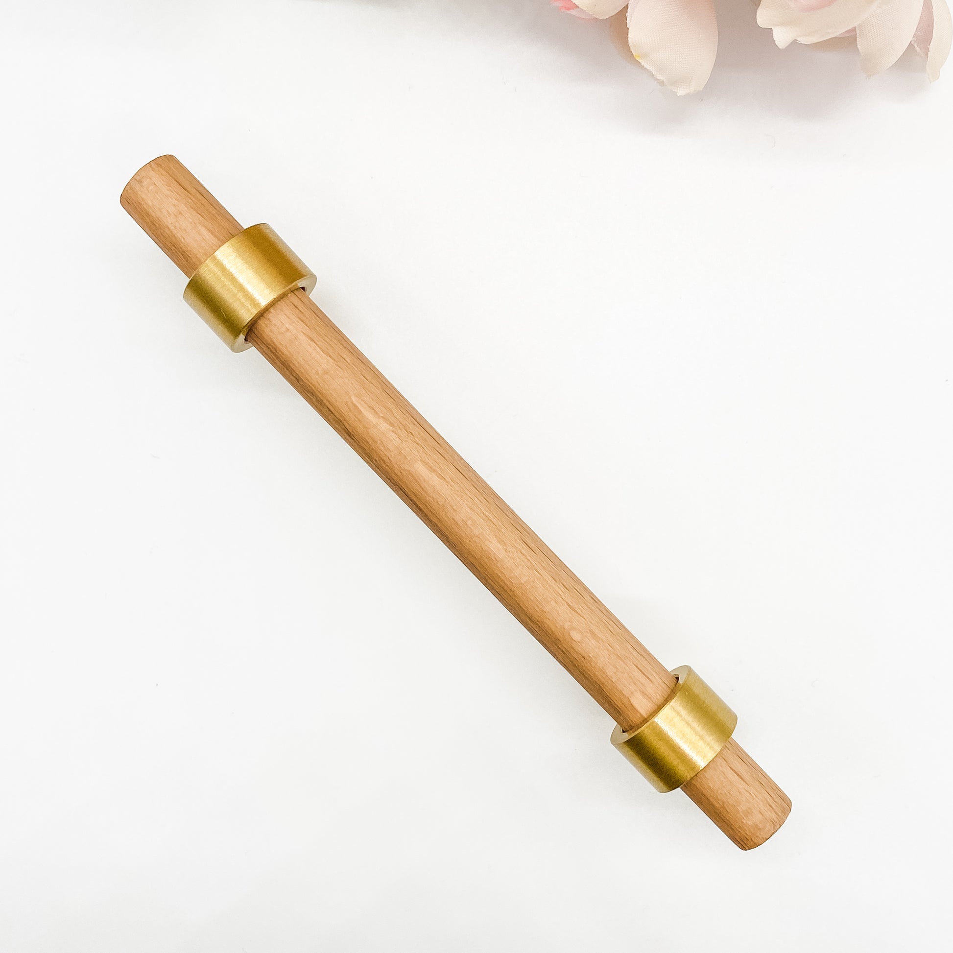 160mm timber drawer handle with brass clasps on white background