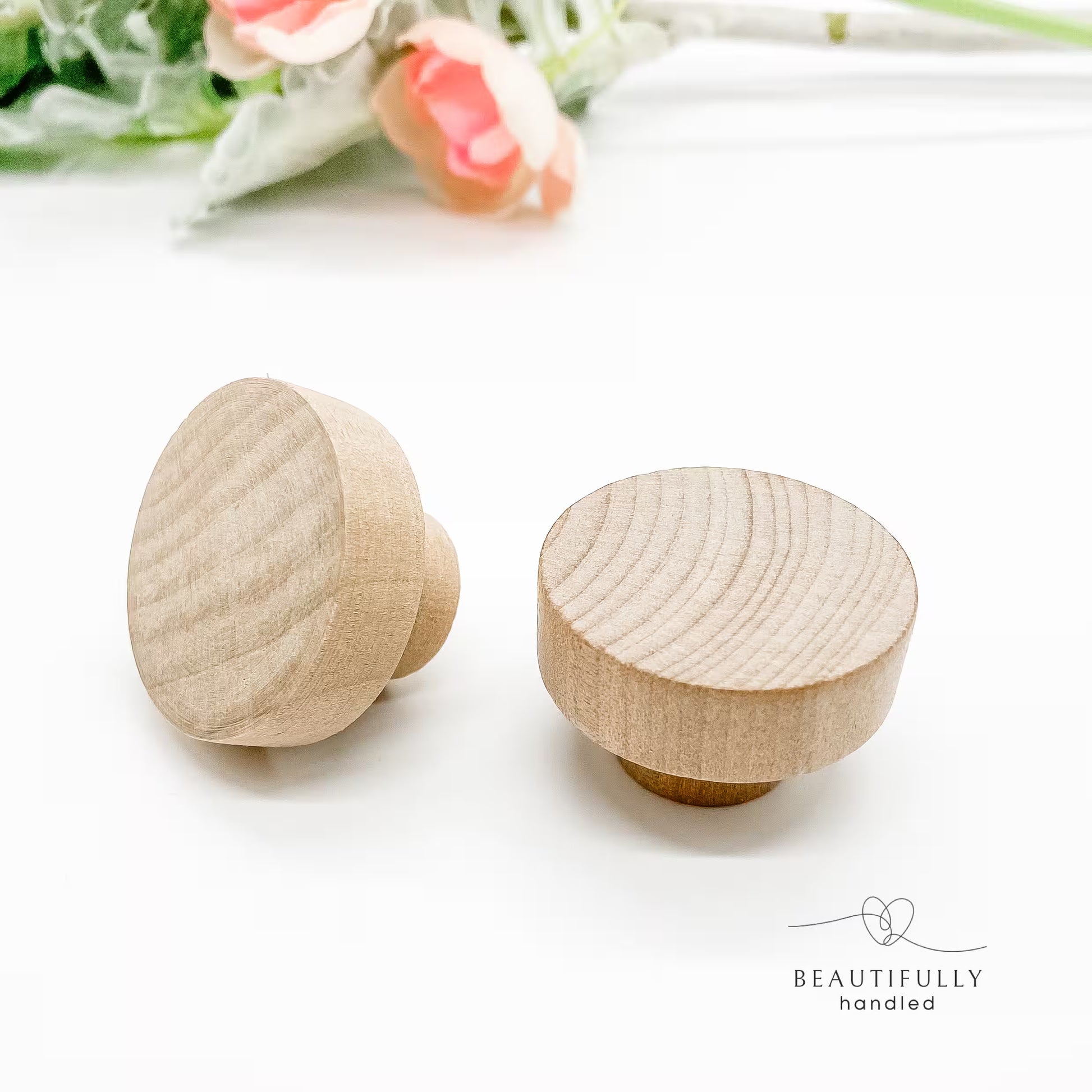 Two wooden knobs 40mm on a white background