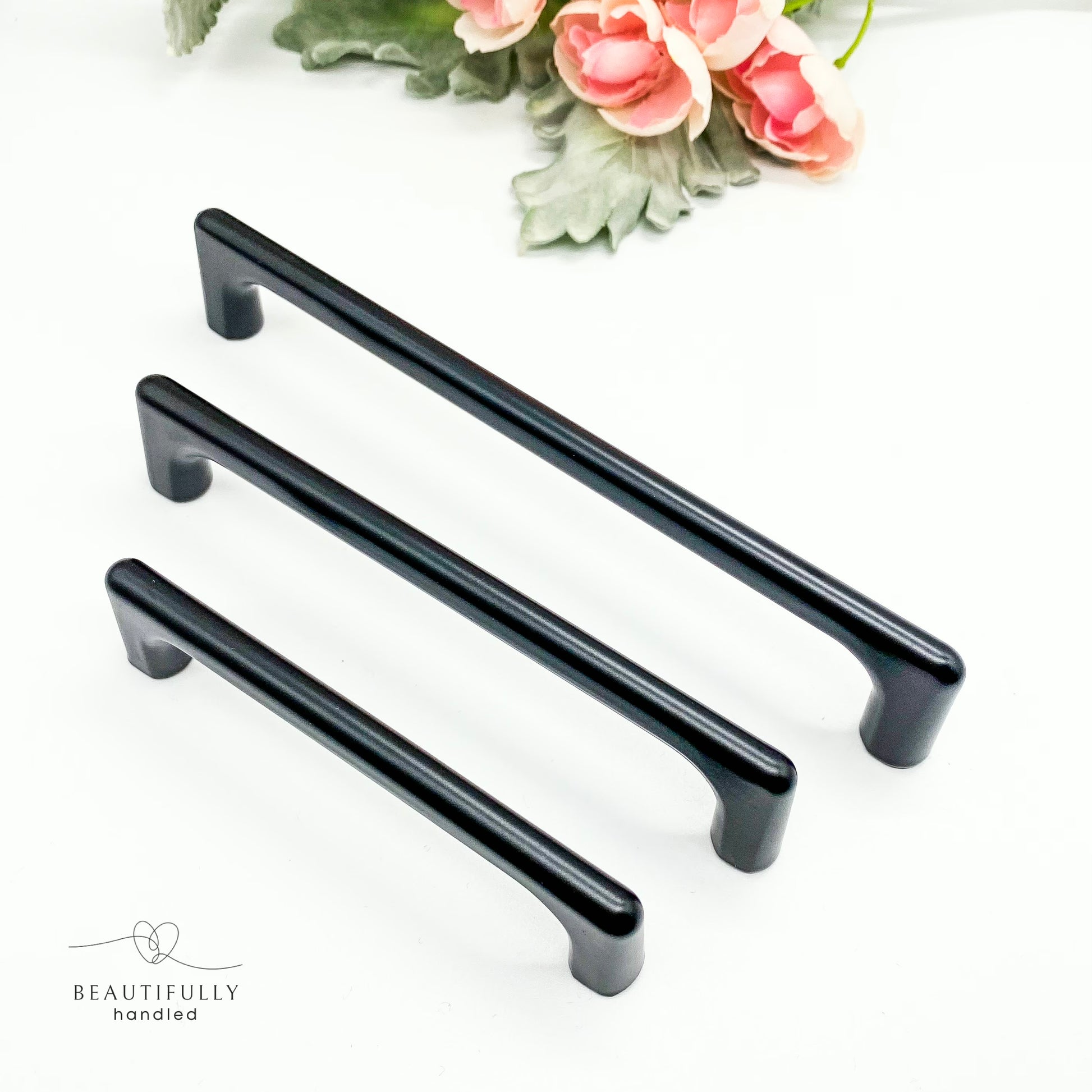Three black cabinet handles 96mm 128mm 160mm on a white background.