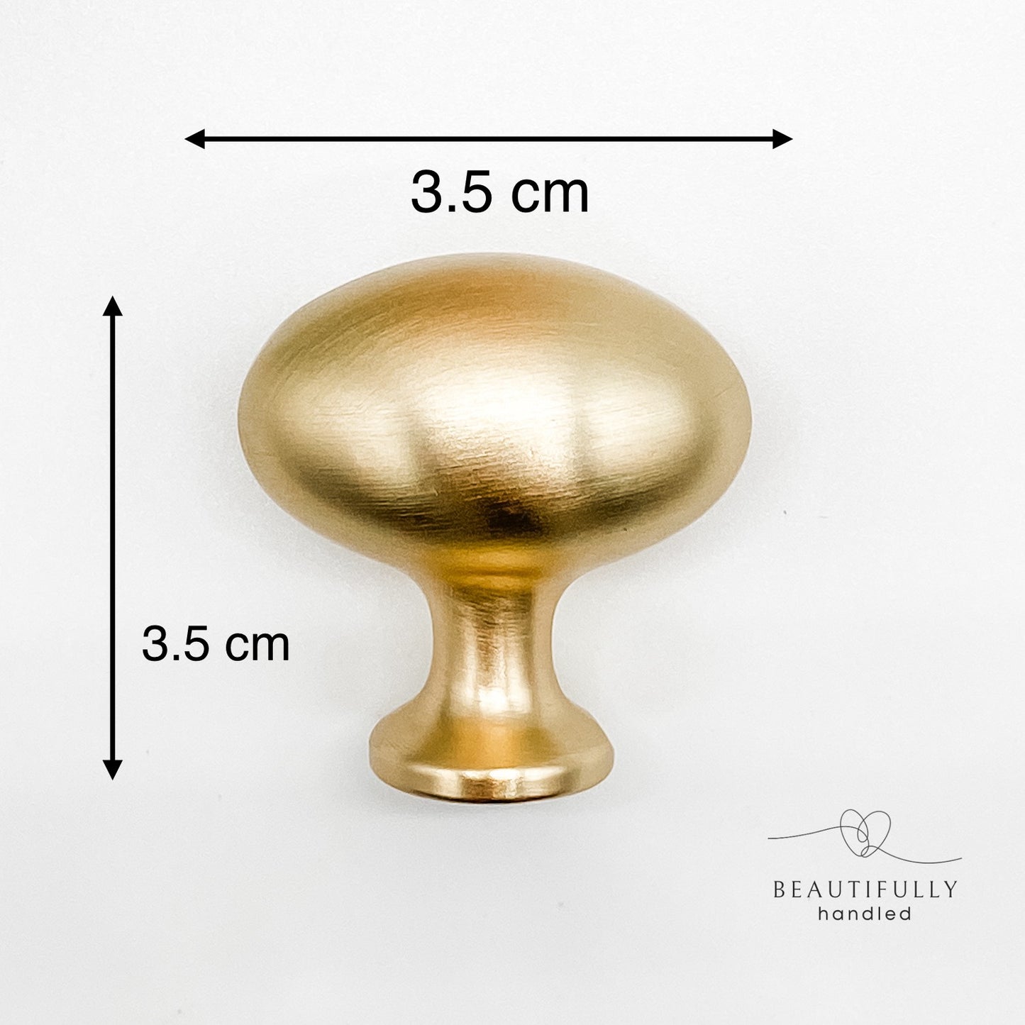 Brushed gold oval-shaped solid knob