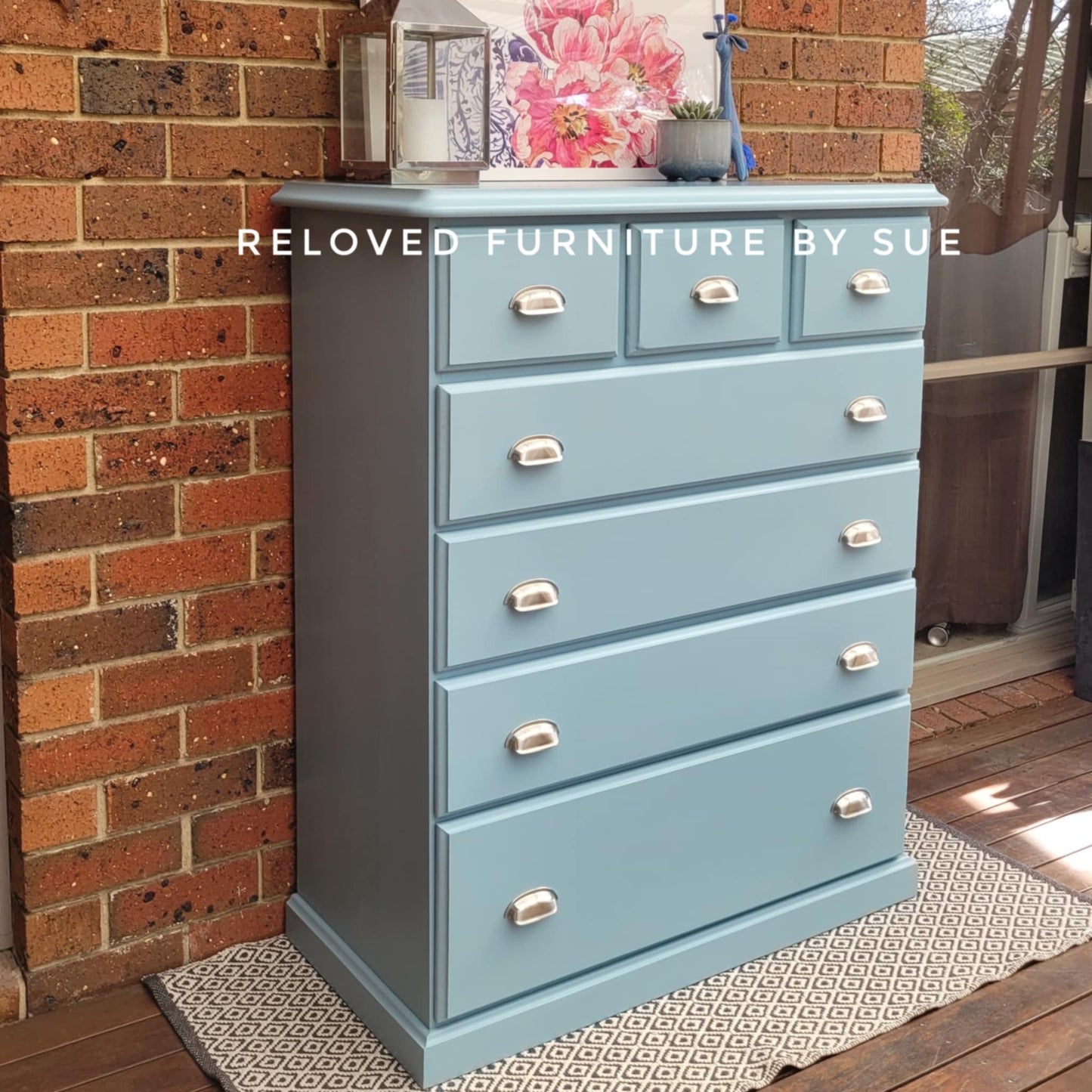 set of blue drawers featuring chrome cup pulls 