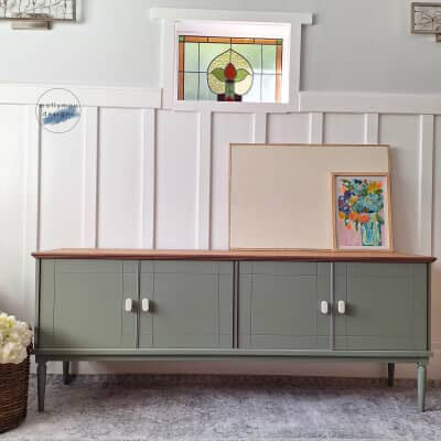 marble drawer knob on sage green buffet in living room 