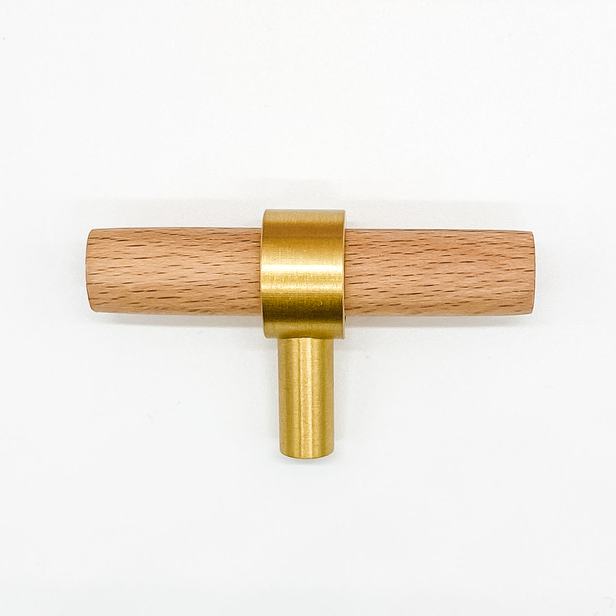 Brass and wooden T-bar handle on a white background