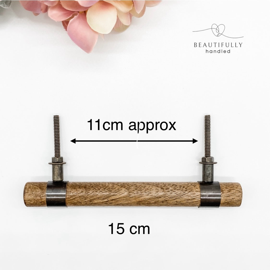 Wooden handle with metal claps and measurements on a white background
