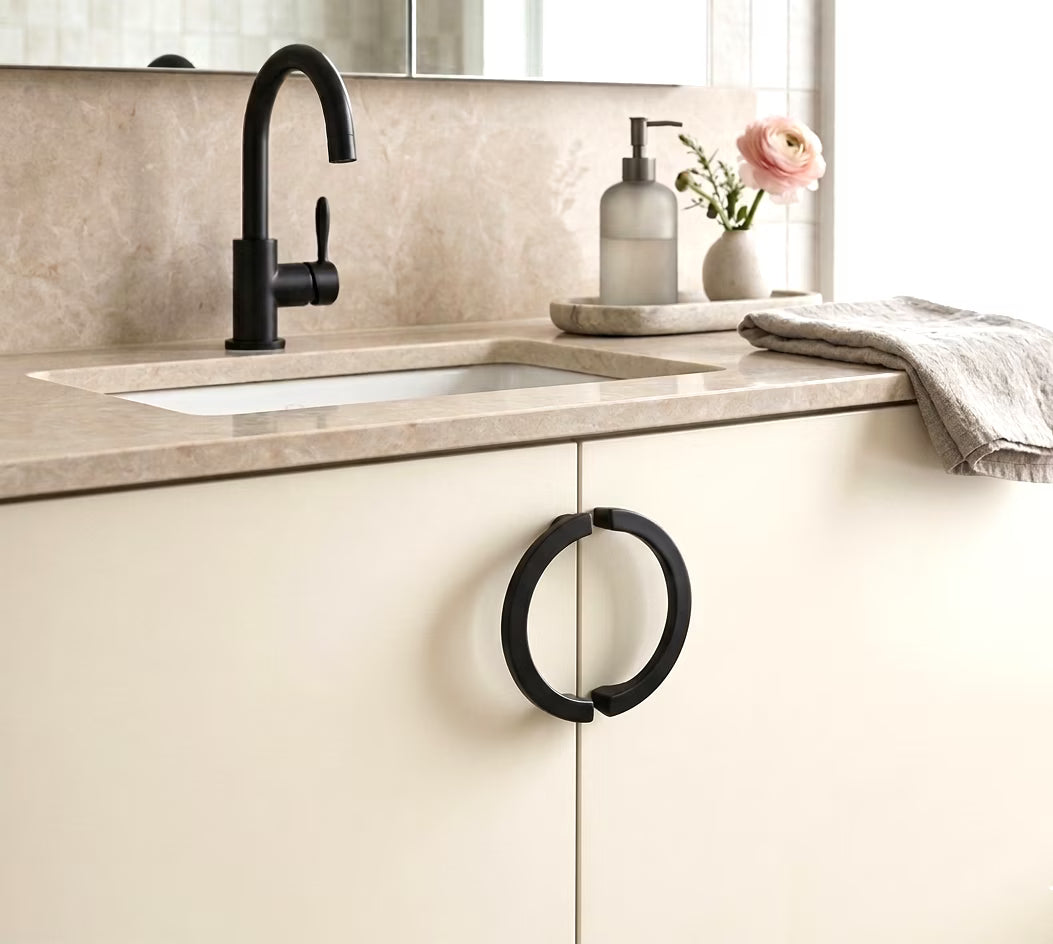 black half moon handle slimline on bathroom cabinets with black tap and stone bench and accessories
