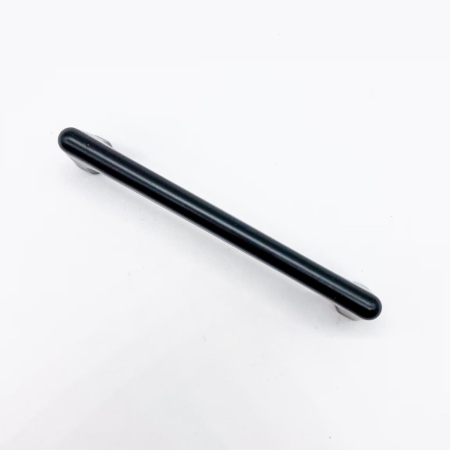 Black drawer handle on a white background top view