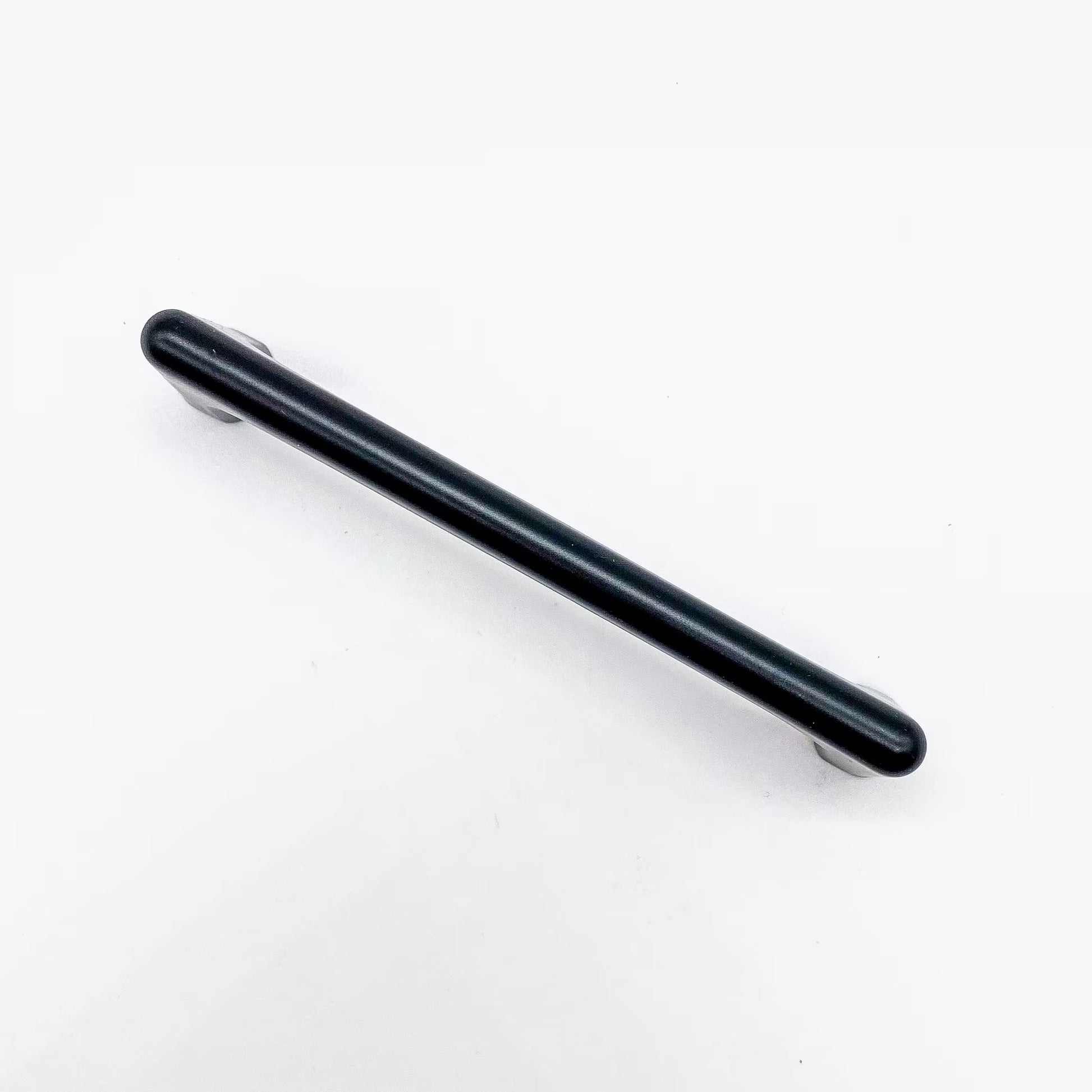 Black drawer handle on a white background top view