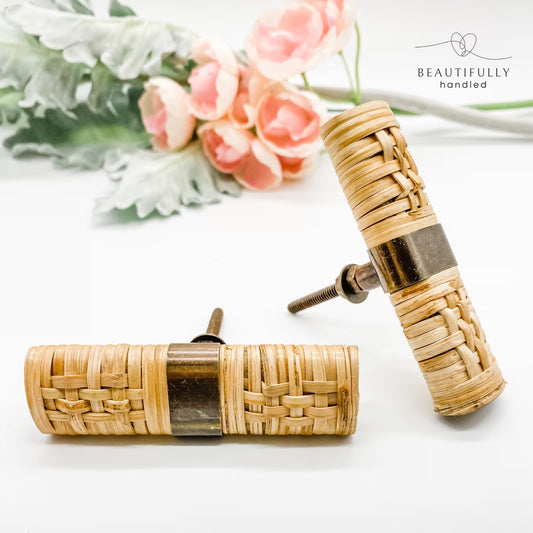 2 rattan woven drawer handles 5cm on white background. one facing out and one on its side