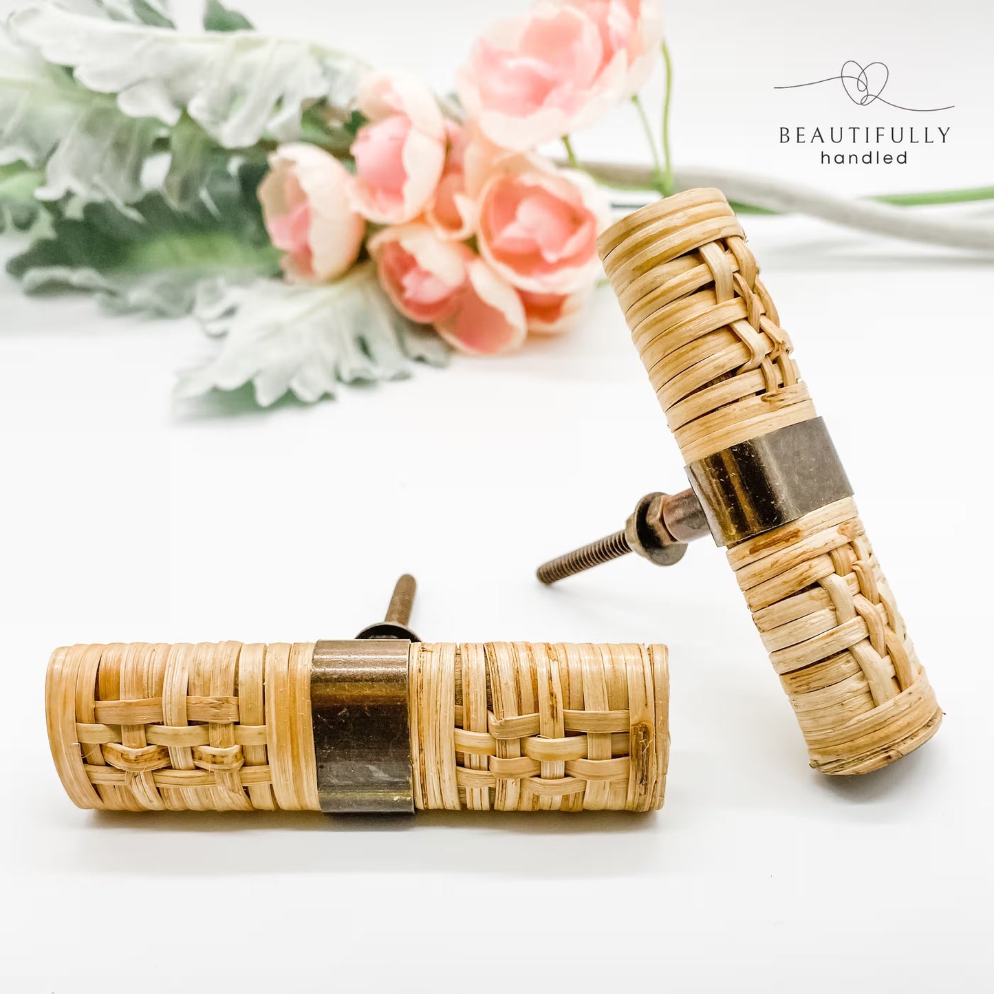 2 rattan woven drawer handles 5cm on white background. one facing out and one on its side