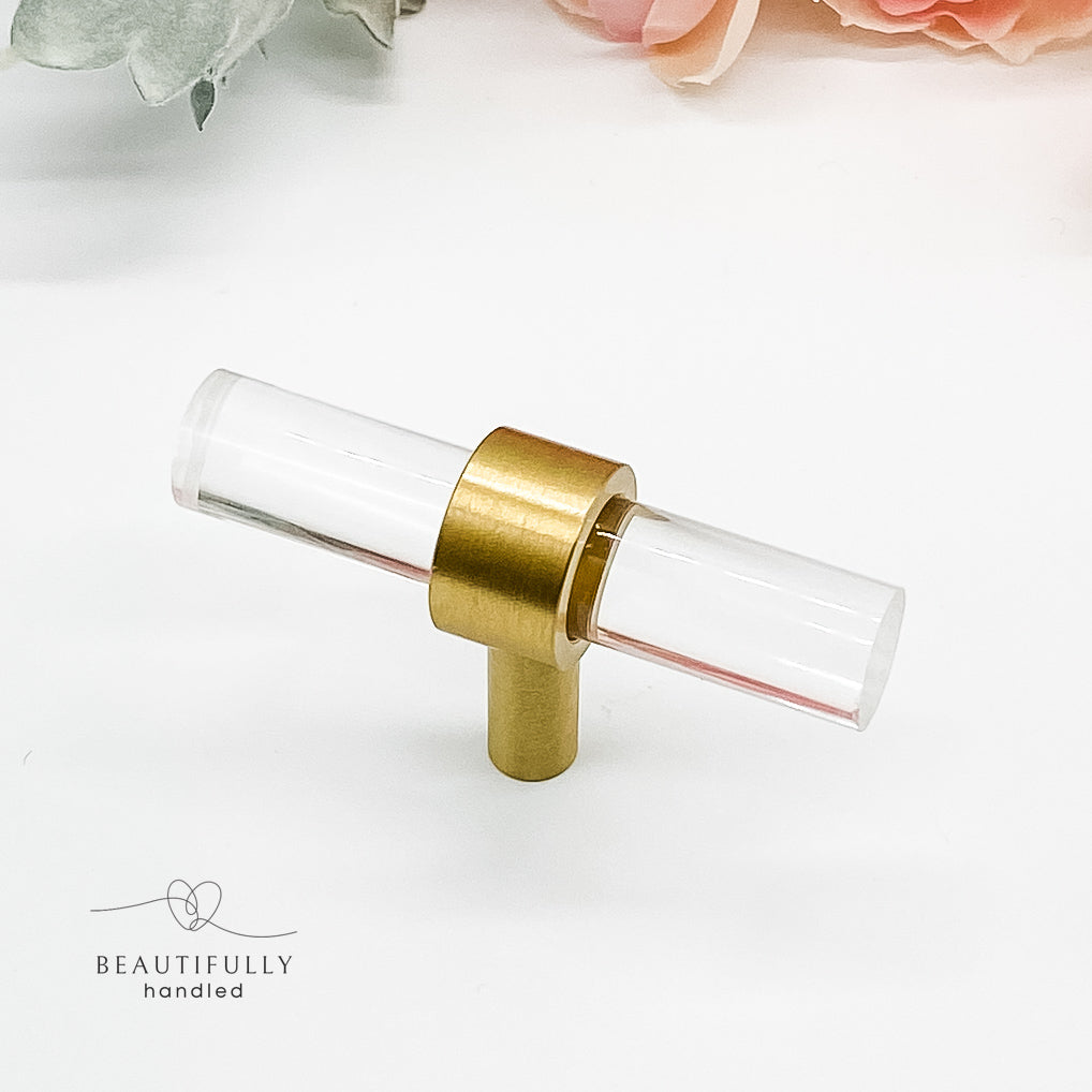 clear drawer handle in small size with brass clasp on white background