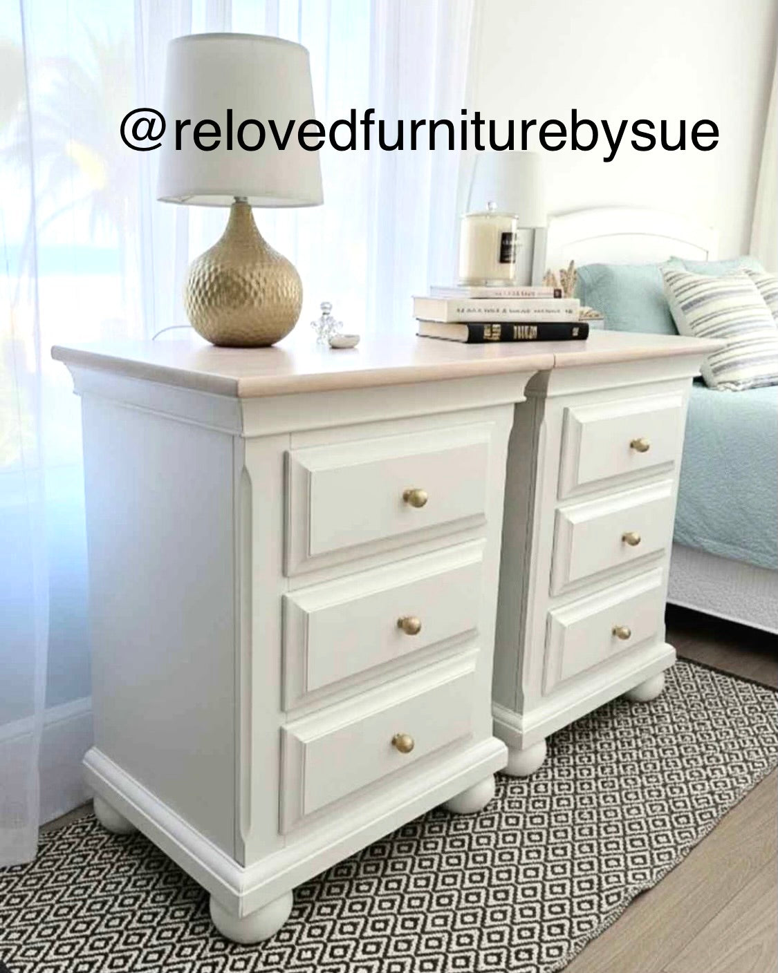 Solid brass round cabinet knob on white bedside tables. 