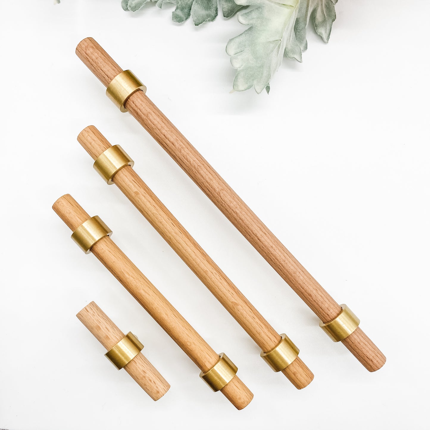 Set of timber drawer handles with gold 