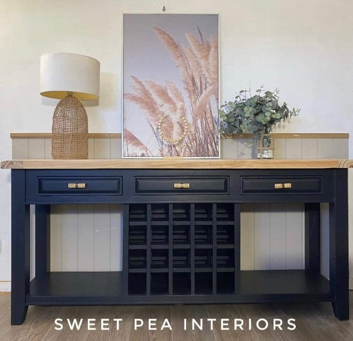 rattan drawer handles on navy blue coastal style buffet with rattan lamp and coastal print